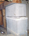 Concrete crawl space support posts in Whiteville that are showing signs of failure as they sink into the earth.