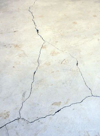 severely cracked, heaving slab floors in a home in Southern Pines