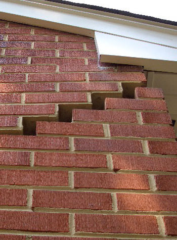 photo of a rotating foundation wall with cracks in Hubert