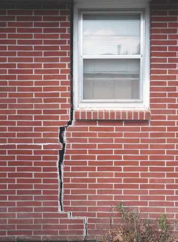 severe foundation wall cracks along a window in Carthage