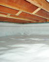 a moisture barrier installed on the walls and floors of a crawl space in Clinton