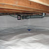 A heating duct extends along this sealed crawl space in New Bern.