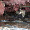 Fiberglass insulation dripping off some heating ducts in a wet crawl space in Pembroke.