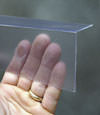 Closeup of a clear plastic covering on a Kinston crawl space block wall