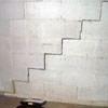 A diagonal stair step crack along the foundation wall of a Hope Mills home