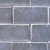 A diagonal stair-step crack found along a foundation wall in a Pinehurst home
