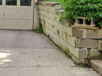 a failing retaining wall around a driveway in Fayetteville