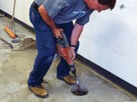 Coring the concrete of a concrete slab floor in Fort Bragg