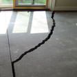a huge crack in a concrete slab floor in Greenville