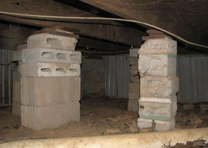 crawl space repairs done with concrete cinder blocks and wood shims in a Hope Mills home