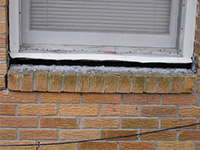 A window sill cracking and separating from the foundation wall in a Hubert home.