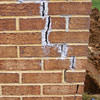 Tuckpointing that cracked due to foundation settlement of a Wilmington home