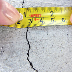 A crack in a poured concrete wall that's showing a normal crack during curing in Rocky Point