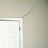 A long drywall crack beginning at the corner of a doorway in a Laurinburg home.