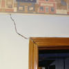 A large settlement crack on interior drywall in a Leland home.