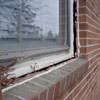 A gap in a window along the outer wall due to foundation settlement of a Havelock home.