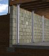 I-beam foundation wall supports installed in a La Grange basement.