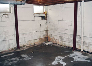A failed, rusty i-beam foundation wall system installed in Hubert.