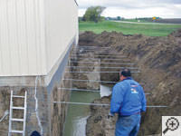 Drilling the hole in the foundation wall repairs in Spring Lake