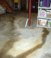 Flooding entering a basement through a floor crack in Laurinburg