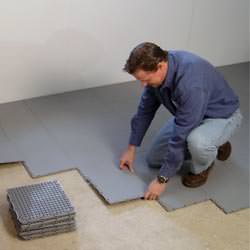 basement subfloor tiles being installed by a contractor in Dudley