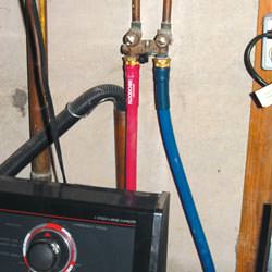 Washer hoses in a basement  in La Grange