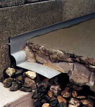 a custom designed basement drain system for thin basement floors in Saint Pauls.