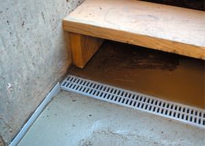a hatchway entrance in Laurinburg that has been protected from flooding by our TrenchDrain basement drainage system.
