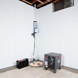 a complete basement waterproofing system installed in a Wilmington home