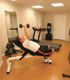 a basement gym and workout room with a wood laminate flooring, installed in Goldsboro, NC