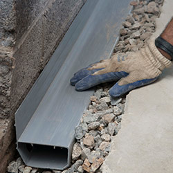 installing a drain tile system in a Southern Pines home